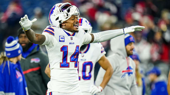 Stefon Diggs gesturing with his helmet only half on top of his head